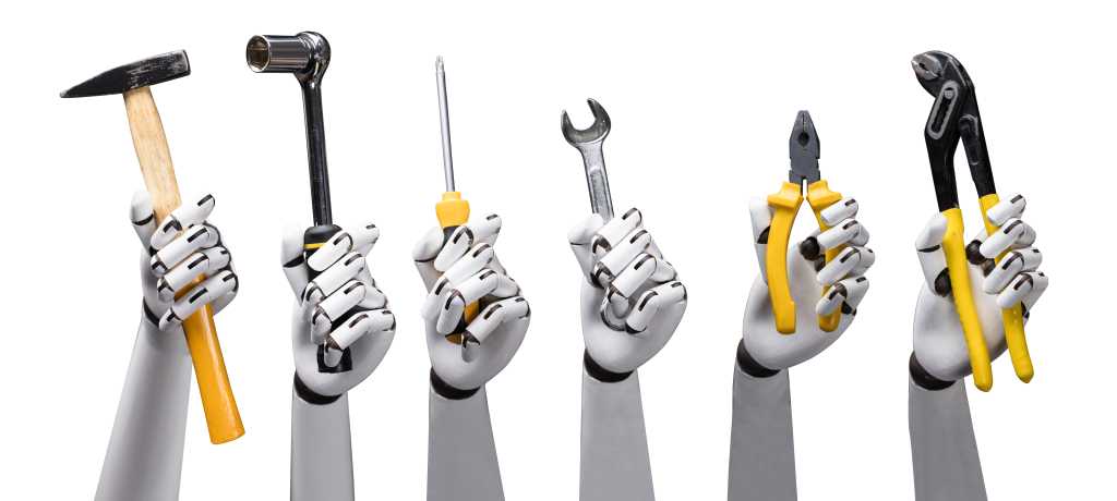 Close-up of robot hands holding tools on white background